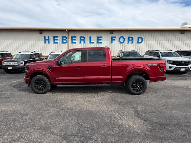 2026 Ford F-150 XLT in Ruby Red Metallic Tinted Clearcoat — front three-quarter view