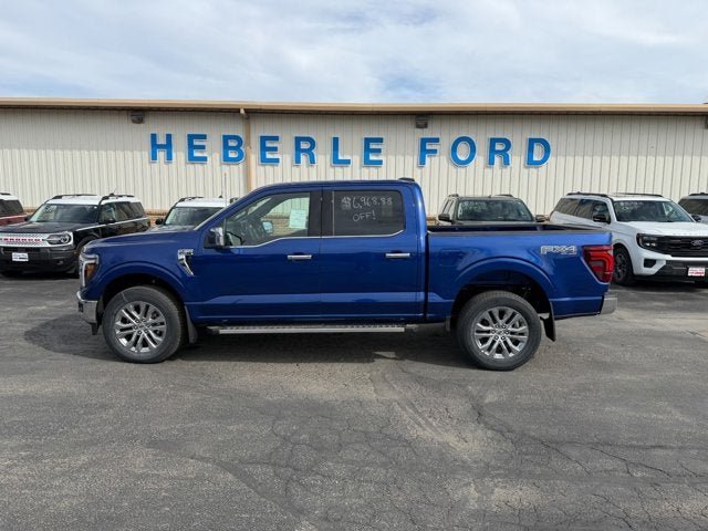 2026 Ford F-150 LARIAT in Argon Blue Metallic — front three-quarter view